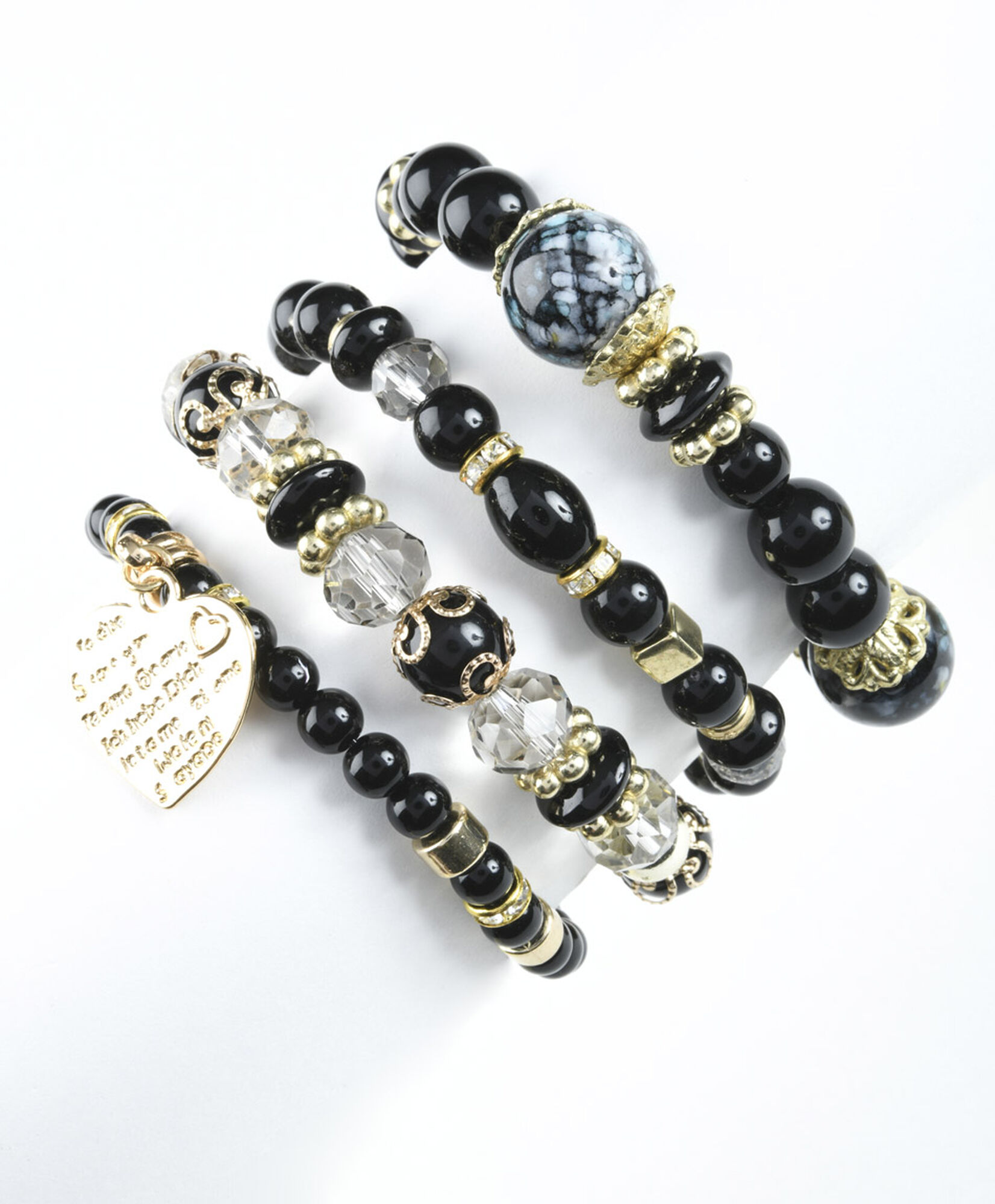 Set 4 pulseras mujer dijes negras Set 4 pulseras mujer dijes negras