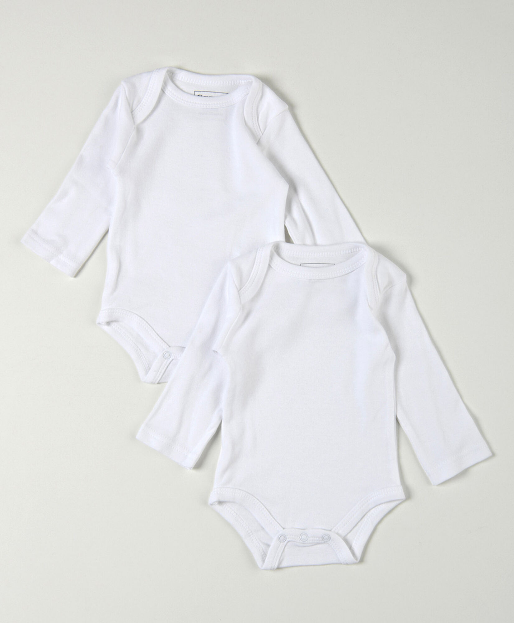 Pack 2 bodies bebé blancos manga larga Pack 2 bodies bebé blancos manga larga