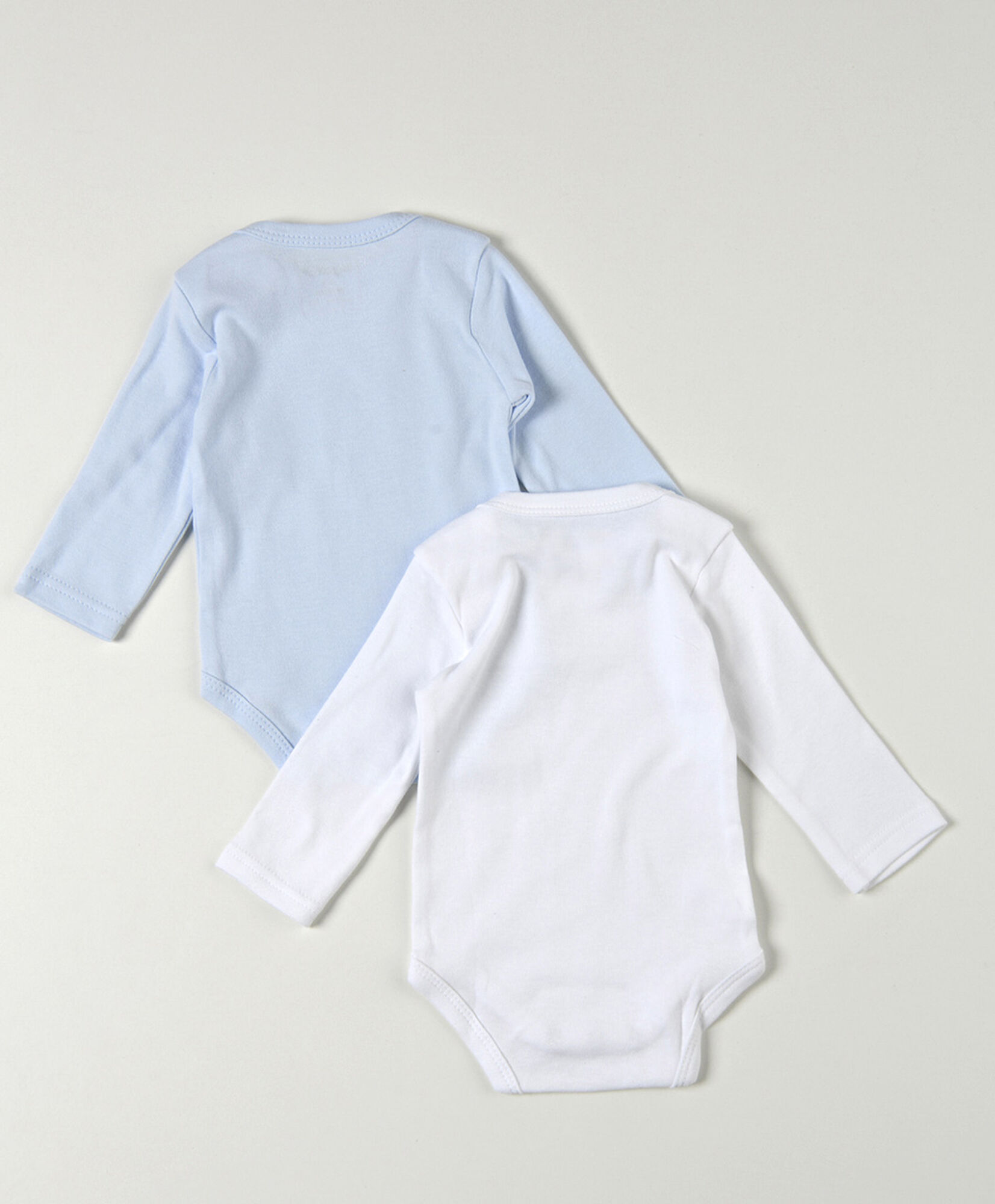 Pack 2 bodies bebé blanco y azul manga larga Pack 2 bodies bebé blanco y azul manga larga
