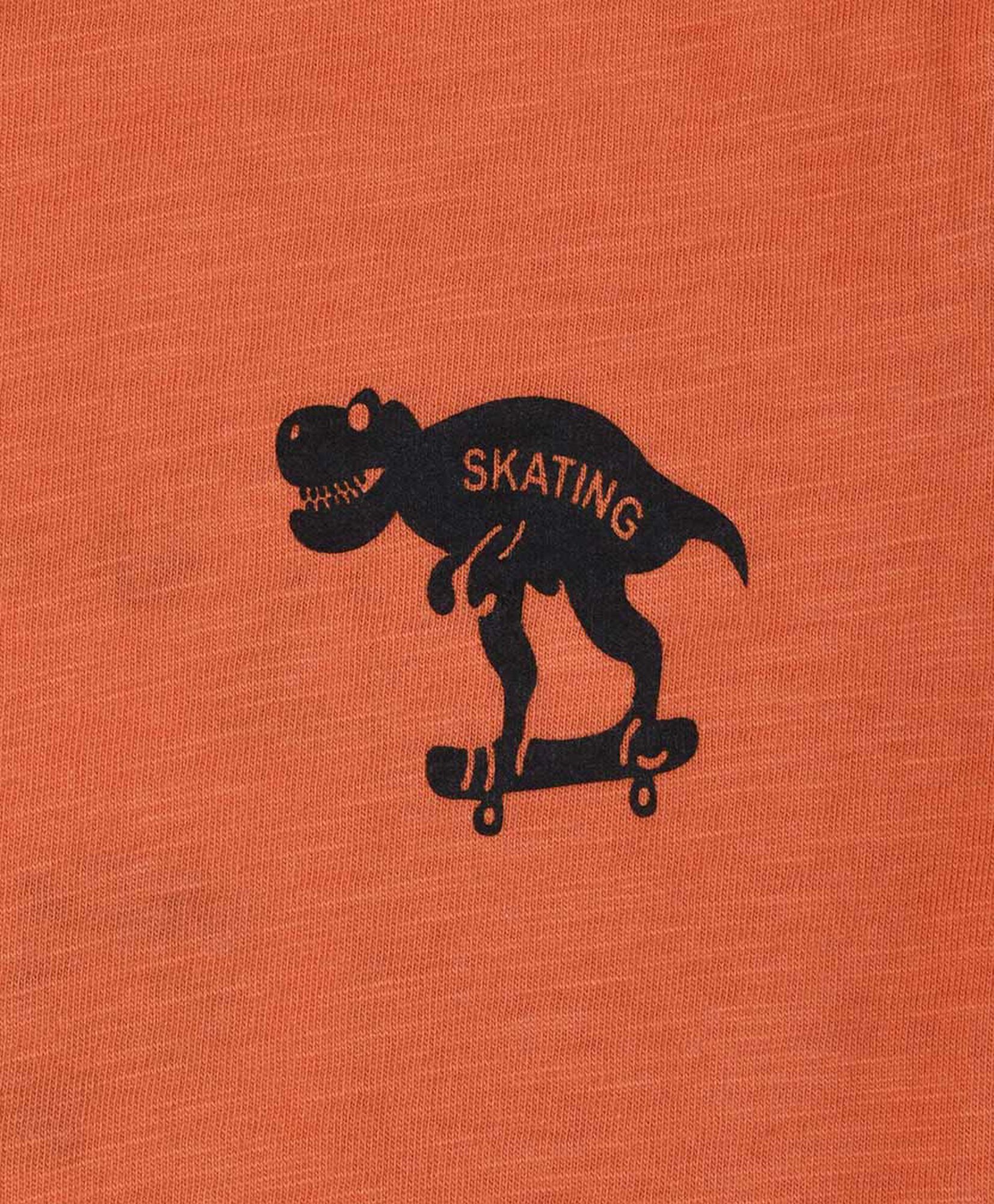 Polera bebé dinosaurio skate naranja Polera bebé dinosaurio skate naranja