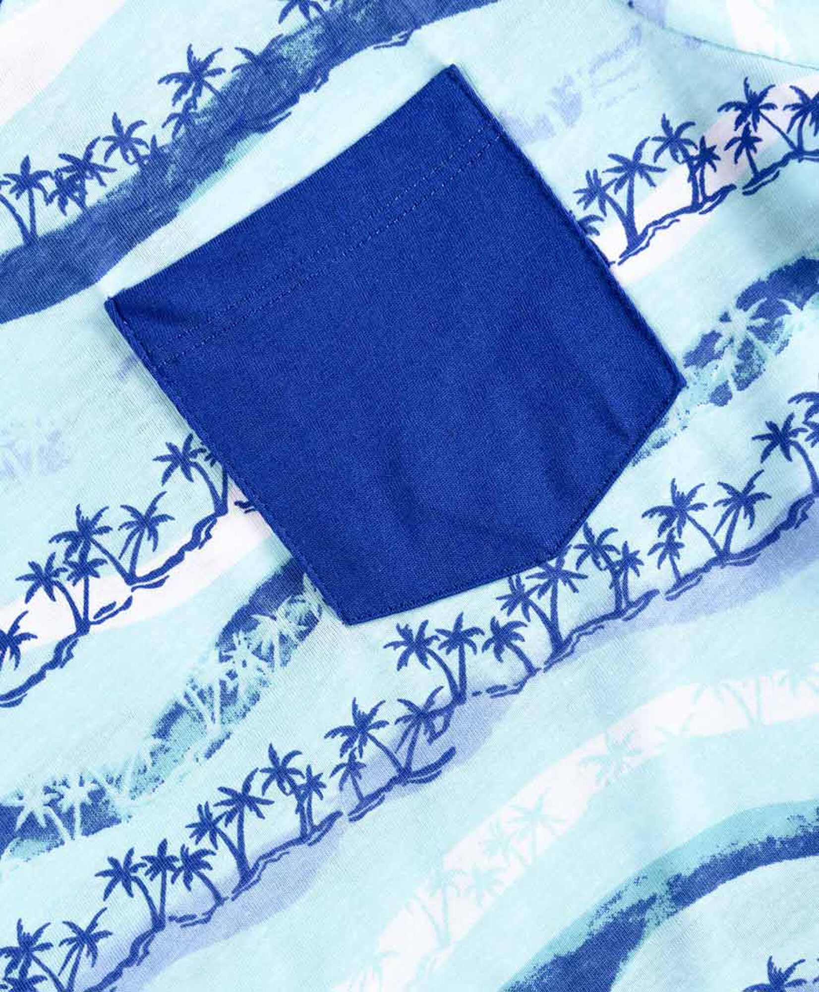 Polera niño bolsillos y palmeras Polera niño bolsillos y palmeras